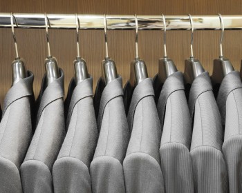 Row of men suit jackets in apparel store